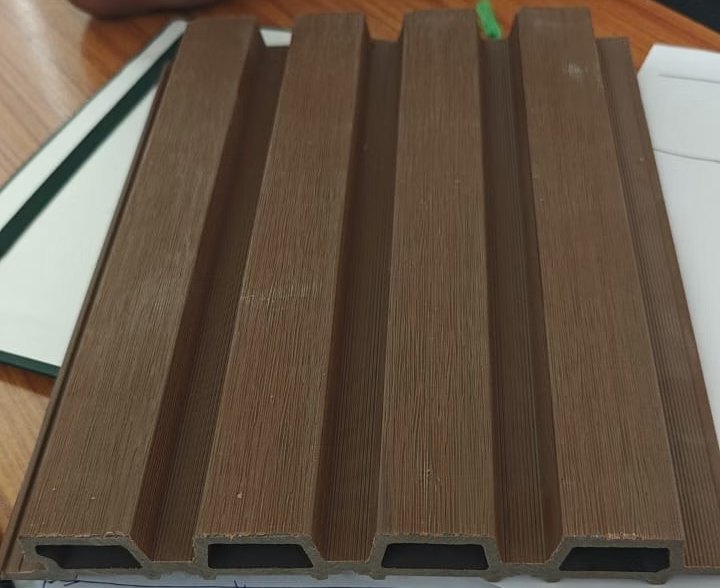 Unity Group pool — the client's fluted wood-panel ceiling sample