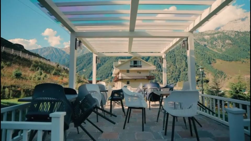 Rooftop pergola seating area lighting at The Golden Meadows Resort