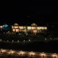 The Golden Meadows Resort fully lit at night with pathway and landscape lighting