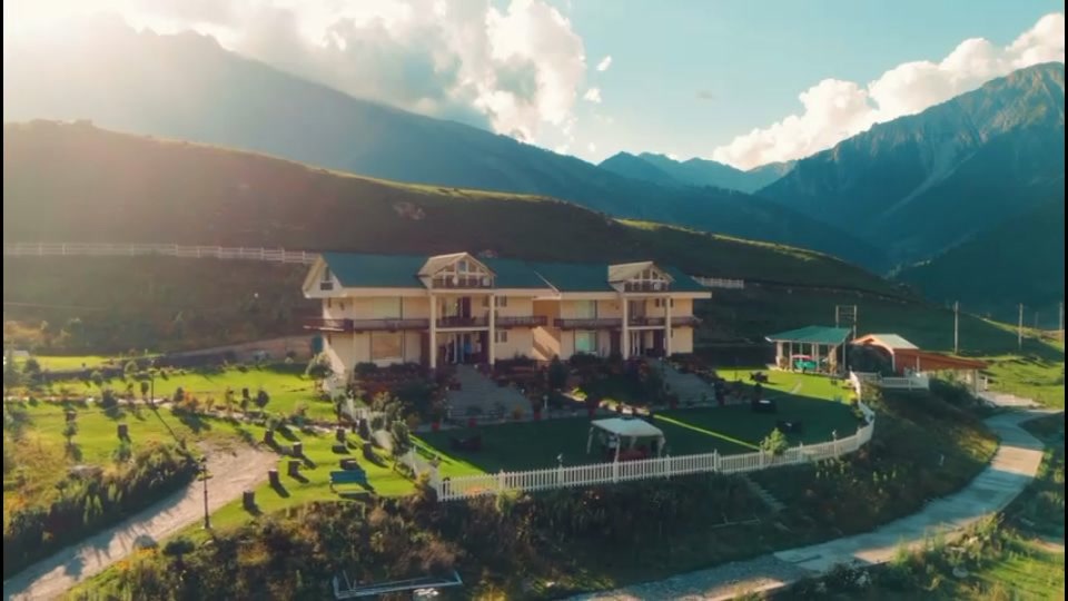 Aerial daytime view of The Golden Meadows Resort, Sonamarg, in the mountains