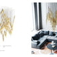 SYMPHONY XL2 composition — diamond-lattice gold rod suspension chandelier installed in a living room
